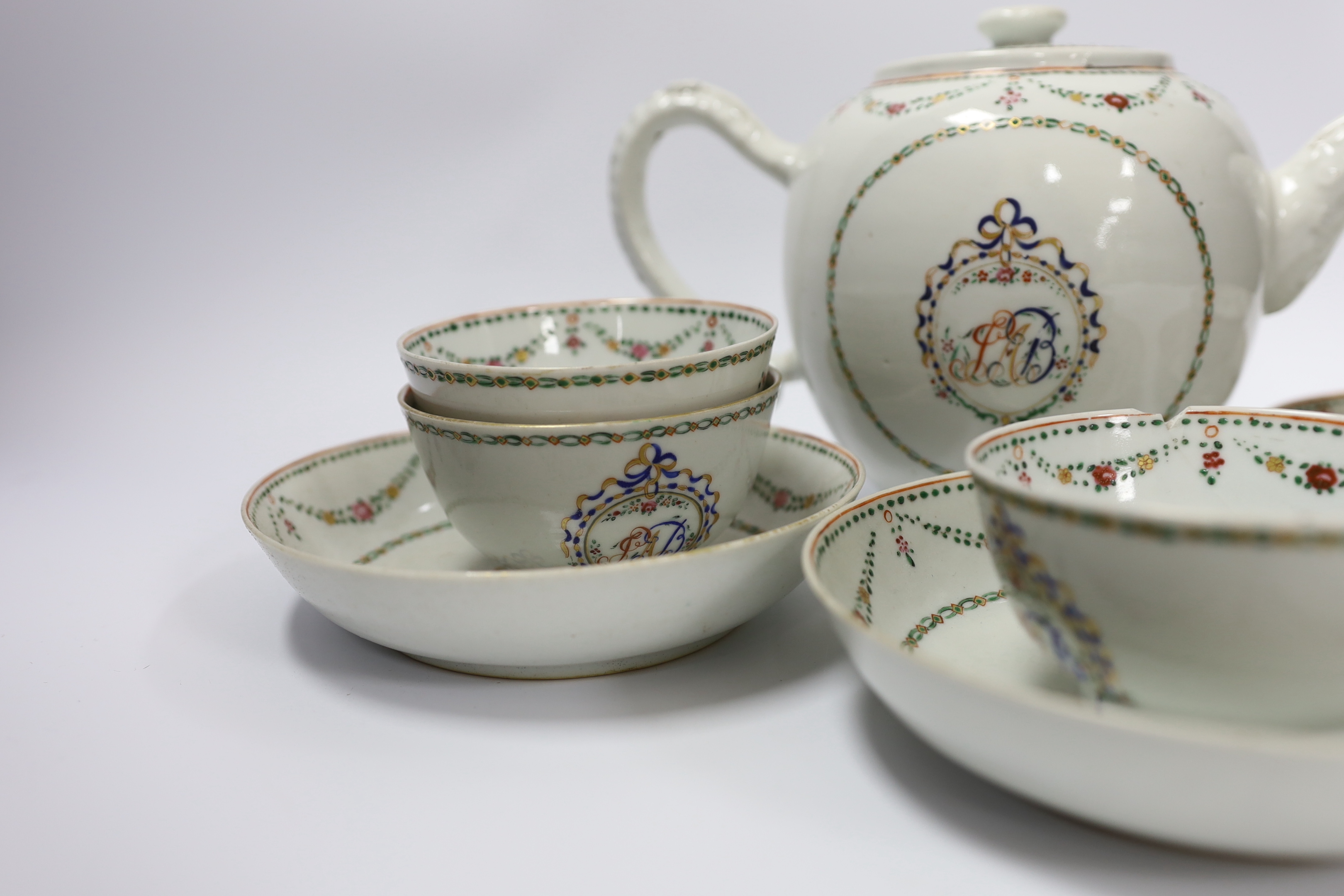 A Chinese export famille rose teapot, four tea bowls and three saucers, all Jiaqing period